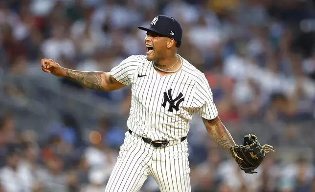 New York Yankees' Luis Gil reacts after the third out during the sixth inning of a baseball game against the Boston Red Sox, Sunday, July 7, 2024, in New York. (AP Photo/Noah K. Murray)