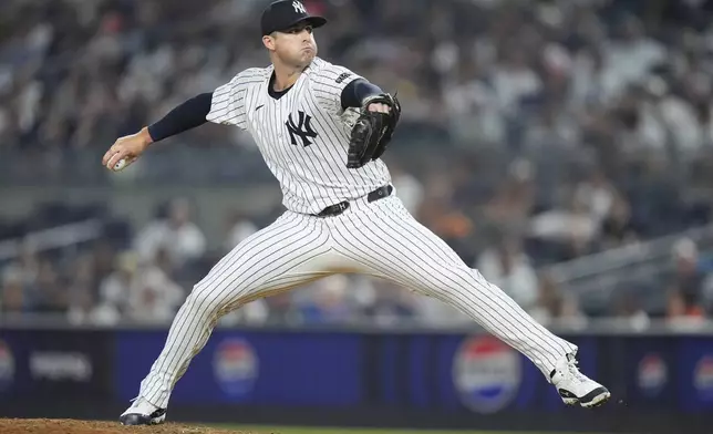 New York Yankees' Clay Holmes pitches during the ninth inning of a baseball game against the Boston Red Sox, Friday, July 5, 2024, in New York. (AP Photo/Frank Franklin II)