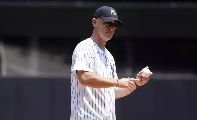 University of Connecticut men's basketball head coach Dan Hurley throws out the ceremonial first pitch before the first inning of a baseball game between the New York Yankees and the Boston Red Sox, Saturday, July 6, 2024, in New York. (AP Photo/Pamela Smith)