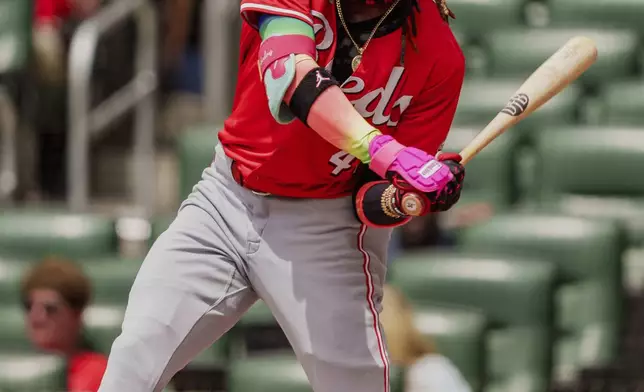 Cincinnati Reds Elly De La Cruz swings and misses in the first inning of the first baseball game of a doubleheader against the Atlanta Braves, Wednesday, July 24, 2024, in Atlanta. (AP Photo/Jason Allen)