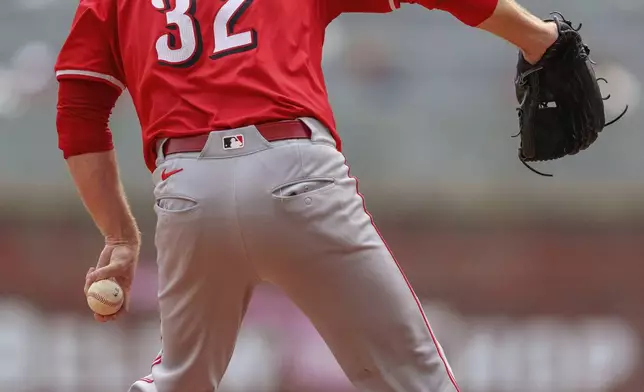 Cincinnati Reds pitcher Justin Wilson throws in the ninth inning of the first baseball game of a doubleheader against the Atlanta Braves, Wednesday, July 24, 2024, in Atlanta. (AP Photo/Jason Allen)