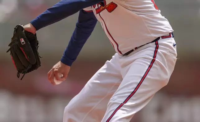 Atlanta Braves pitcher Jesse Chavez throws in the ninth inning of the first baseball game of a doubleheader against the Cincinnati Reds, Wednesday, July 24, 2024, in Atlanta. (AP Photo/Jason Allen)