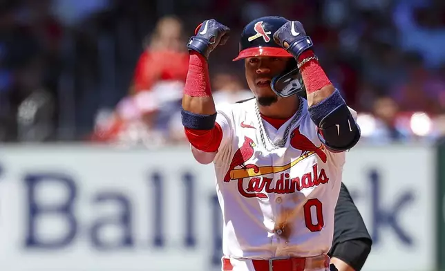 St. Louis Cardinals' Masyn Winn gestures toward the dugout after hitting an RBI double during the sixth inning of a baseball game against the Cincinnati Reds, Sunday, June 30, 2024, in St. Louis. (AP Photo/Scott Kane)