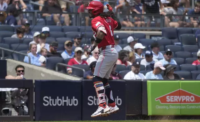 Cincinnati Reds' Jonathan India celebrates hitting a home run during the third inning of a baseball game against the New York Yankees, Thursday, July 4, 2024, in New York. (AP Photo/Pamela Smith)