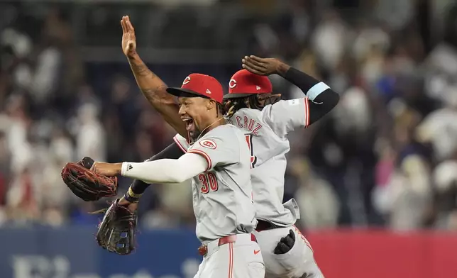 Cincinnati Reds' Will Benson (30) celebrates with Elly De La Cruz after a baseball game against the New York Yankees, Tuesday, July 2, 2024, in New York. The Reds won 5-4. (AP Photo/Frank Franklin II)