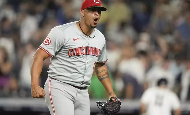 Cincinnati Reds pitcher Fernando Cruz reacts after New York Yankees' Aaron Judge hit into a double play during the seventh inning of a baseball game, Wednesday, July 3, 2024, in New York. (AP Photo/Frank Franklin II)
