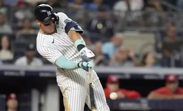 New York Yankees' Aaron Judge hits a home run during the seventh inning of a baseball game against the Cincinnati Reds, Tuesday, July 2, 2024, in New York. (AP Photo/Frank Franklin II)