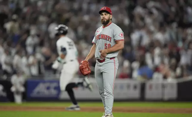 Cincinnati Reds pitcher Sam Moll (50) reacts as New York Yankees' Aaron Judge runs the bases after hitting a home run during the seventh inning of a baseball game, Tuesday, July 2, 2024, in New York. (AP Photo/Frank Franklin II)