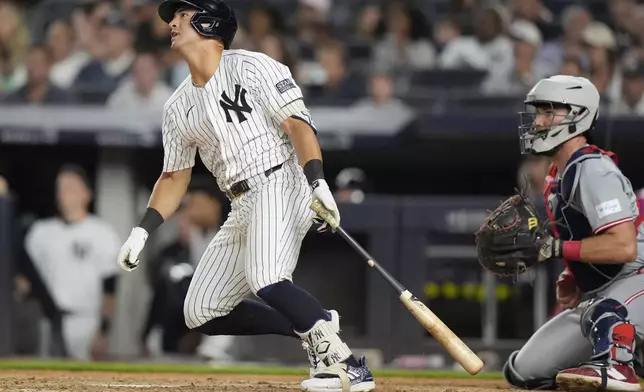 New York Yankees' Anthony Volpe follows through on a two-run double during the seventh inning of a baseball game against the Cincinnati Reds, Wednesday, July 3, 2024, in New York. (AP Photo/Frank Franklin II)