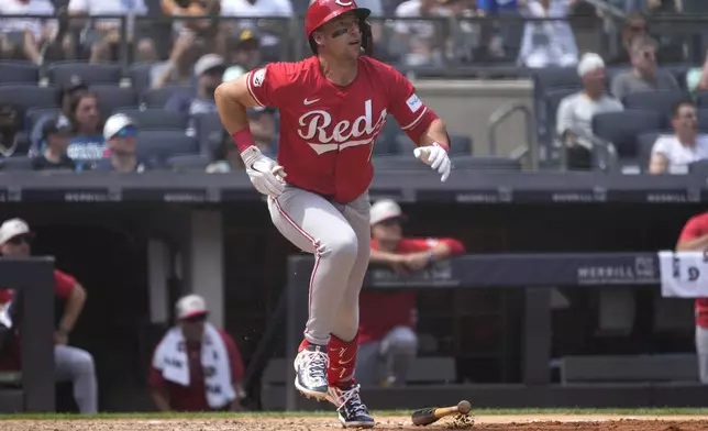 Cincinnati Reds' Spencer Steer runs to first base after hitting a home run, scoring teammates Jonathan India and Elly De La Cruz, during the fifth inning of a baseball game against the New York Yankees, Thursday, July 4, 2024, in New York. (AP Photo/Pamela Smith)