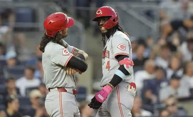 Cincinnati Reds' Elly De La Cruz, right, celebrates with Jonathan India after they score on a two-run home run during the fifth inning of a baseball game against the New York Yankees, Tuesday, July 2, 2024, in New York. (AP Photo/Frank Franklin II)