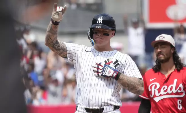 New York Yankees' Alex Verdugo celebrates hitting a double during the fourth inning of a baseball game against the Cincinnati Reds, Thursday, July 4, 2024, in New York. (AP Photo/Pamela Smith)