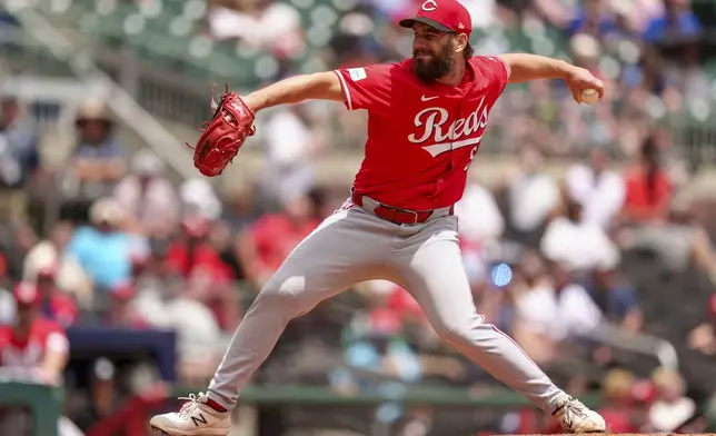 Cincinnati Reds pitcher Sam Moll throws in the fifth inning of the first baseball game of a doubleheader against the Atlanta Braves, Wednesday, July 24, 2024, in Atlanta. (AP Photo/Jason Allen)