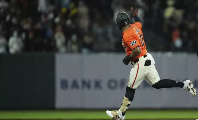 San Francisco Giants' Heliot Ramos runs the bases after hitting a three-run home run against the Colorado Rockies during the eighth inning of a baseball game Friday, July 26, 2024, in San Francisco. (AP Photo/Godofredo A. Vásquez)