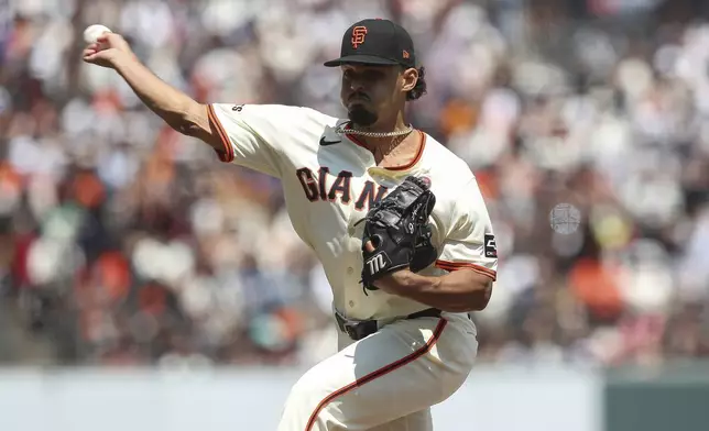 San Francisco Giants pitcher Jordan Hicks throws to a Colorado Rockies batter during the sixth inning of a baseball game in San Francisco, Sunday, July 28, 2024. (AP Photo/Kavin Mistry)