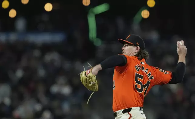 San Francisco Giants pitcher Mike Baumann throws to a Colorado Rockies batter during the eighth inning of a baseball game Friday, July 26, 2024, in San Francisco. (AP Photo/Godofredo A. Vásquez)