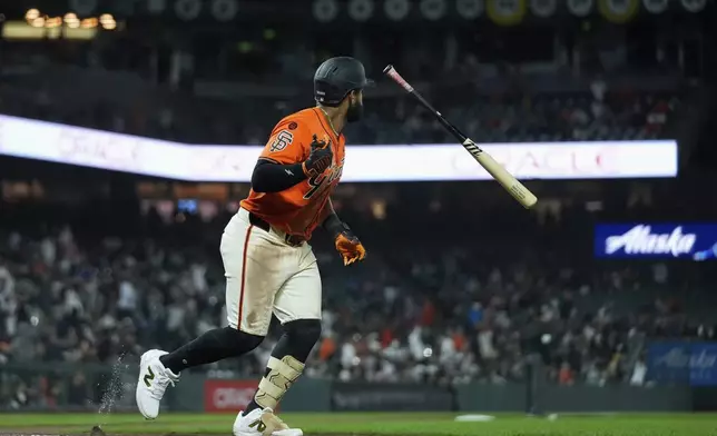 San Francisco Giants' Heliot Ramos flips his bat after hitting a three-run home run against the Colorado Rockies during the eighth inning of a baseball game Friday, July 26, 2024, in San Francisco. (AP Photo/Godofredo A. Vásquez)