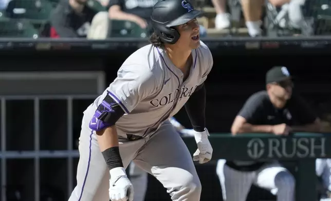 Colorado Rockies' Michael Toglia watches his sacrifice fly to Chicago White Sox center fielder Luis Robert Jr. during the 14th inning of a baseball game in Chicago, Sunday, June 30, 2024. (AP Photo/Nam Y. Huh)