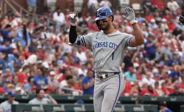 Kansas City Royals' MJ Melendez arrives home after hitting a solo home run during the third inning in the second game of a baseball doubleheader against the St. Louis Cardinals Wednesday, July 10, 2024, in St. Louis. (AP Photo/Jeff Roberson)