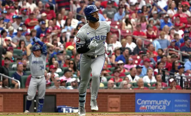 Kansas City Royals' MJ Melendez watches his solo home run during the third inning in the second game of a baseball doubleheader against the St. Louis Cardinals Wednesday, July 10, 2024, in St. Louis. (AP Photo/Jeff Roberson)