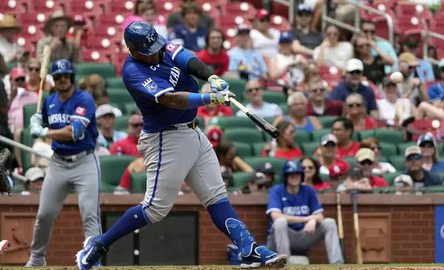 Kansas City Royals' Salvador Perez hits a solo home run during the sixth inning in the first game of a baseball doubleheader against the St. Louis Cardinals Wednesday, July 10, 2024, in St. Louis. (AP Photo/Jeff Roberson)