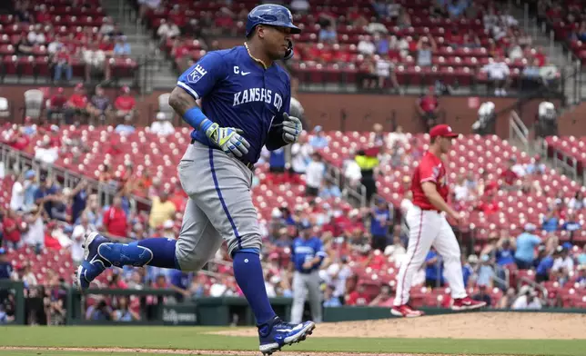 Kansas City Royals' Salvador Perez, left, rounds the bases after hitting a solo home run off St. Louis Cardinals starting pitcher Andre Pallante, right, during the sixth inning in the first game of a baseball doubleheader Wednesday, July 10, 2024, in St. Louis. (AP Photo/Jeff Roberson)