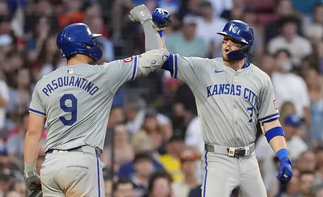 Kansas City Royals' Bobby Witt Jr. (7) celebrates after his solo home run with Vinnie Pasquantino (9) during the fourth inning of a baseball game against the Boston Red Sox, Friday, July 12, 2024, in Boston. (AP Photo/Michael Dwyer)