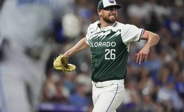 Colorado Rockies starting pitcher Austin Gomber reacts after getting Kansas City Royals' Kyle Isbel to fly out to end the top of the seventh inning of a baseball game Saturday, July 6, 2024, in Denver. (AP Photo/David Zalubowski)