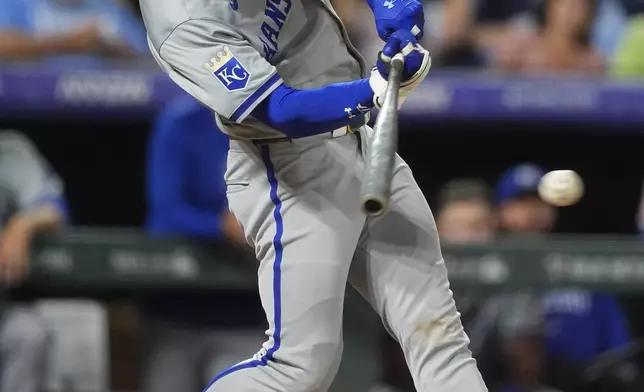 Kansas City Royals' Bobby Witt Jr. singles off Colorado Rockies relief pitcher Tyler Kinley in the eighth inning of a baseball game Saturday, July 6, 2024, in Denver. (AP Photo/David Zalubowski)