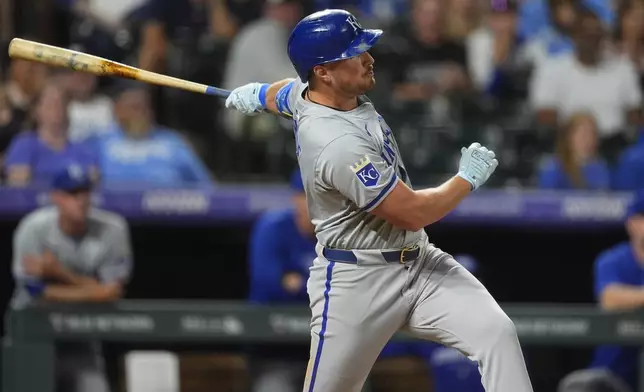 Kansas City Royals' Hunter Renfroe singles against Colorado Rockies relief pitcher Victor Vodnik in the ninth inning of a baseball game Saturday, July 6, 2024, in Denver. (AP Photo/David Zalubowski)