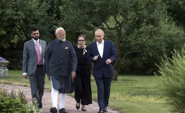 India Prime Minister Narendra Modi, second left, and Russian President Vladimir Putin, right, walk during an informal meeting at Novo-Ogaryovo residence, outside Moscow, Russia, Monday, July 8, 2024. (Sergei Karpukhin, Sputnik, Kremlin Pool Photo via AP)