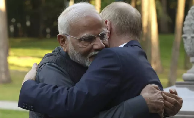 Indian Prime Minister Narendra Modi, left, and Russian President Vladimir Putin embrace during an informal meeting at Novo-Ogaryovo residence, outside Moscow, Russia, Monday, July 8, 2024. (Gavriil Grigorov, Sputnik, Kremlin Pool Photo via AP)