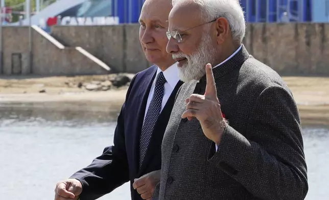 FILE - Russian President Vladimir Putin, left, and Indian Prime Minister Narendra Modi walk during their meeting ahead of the Eastern Economic Forum at the Russky Island, in Vladivostok, Russia, on Sept. 4, 2019. (Mikhail Klimentyev, Sputnik, Kremlin Pool Photo via AP, File)