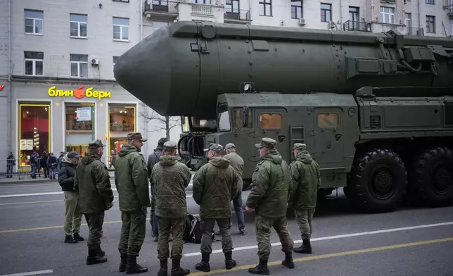 FILE - Soldiers stand next to a Russian RS-24 Yars ballistic missile parked along Tverskaya street prior to a rehearsal for the Victory Day military parade in Moscow, on Thursday, May 2, 2024. (AP Photo/Alexander Zemlianichenko, File)