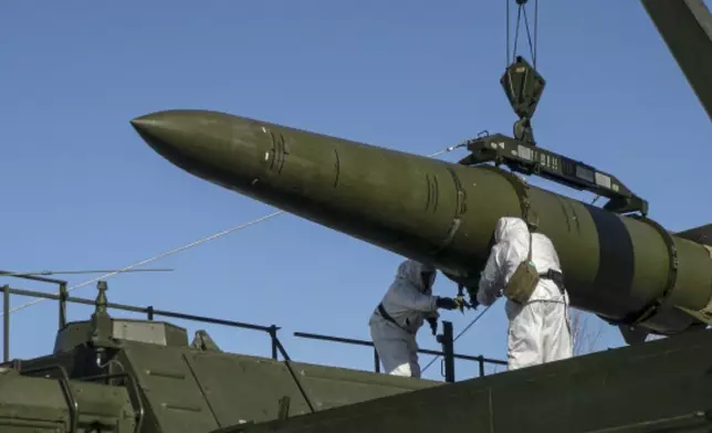 FILE - In this photo released by the Russian Defense Ministry on Feb. 2, 2024, Russian troops load an Iskander missile onto a mobile launcher during drills at an undisclosed location in Russia. (Russian Defense Ministry Press Service via AP, File)