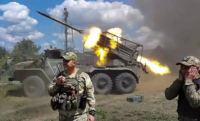 FILE - In this photo taken from video released by the Russian Defense Ministry on Monday, July 1, 2024, Russian soldiers fire from the BM-21 "Grad" self-propelled 122mm multiple rocket launcher in an undisclosed location in Ukraine. (Russian Defense Ministry Press Service via AP, File)