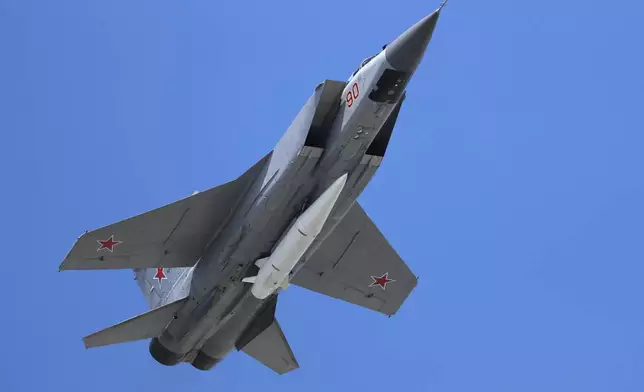 FILE - A Russian Air Force MiG-31K jet carries a high-precision hypersonic aero-ballistic missile Kh-47M2 Kinzhal during the Victory Day military parade to celebrate 73 years since the end of WWII and the defeat of Nazi Germany, in Moscow, on May 9, 2018. (AP Photo/Pavel Golovkin, File)