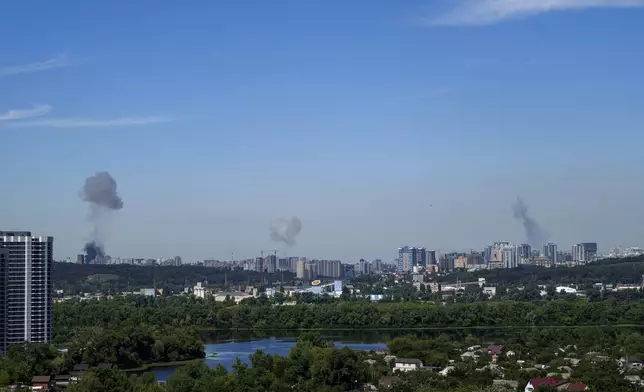 Smoke rises over the Kyiv skyline after a Russian attack, Monday, July 8, 2024. Russian forces launched multiple ballistic and cruise missiles against Ukrainian targets on Monday, Ukraine’s air force said, with explosions felt and heard across the capital, Kyiv. (AP Photo/ Evgeniy Maloletka)