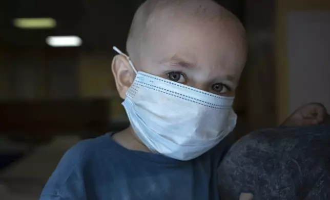 Dmytro, 2, is pictured at the National Cancer Institute in Kyiv, Ukraine, Wednesday, July 10, 2024. Dmytro is one of 31 young patients battling cancer who were relocated to the hospital from Okhmatdyt Children’s Hospital after it was struck by a Russian missile this week. (AP Photo/Alex Babenko)