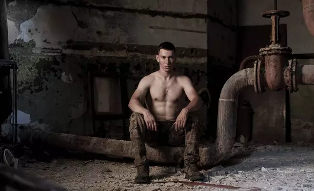 Maj. Oleksii Bordun, a Ukrainian soldier known as Satyrenko who survived the explosions at the Russian-controlled Olenivka prison two years ago, sits for a portrait in Lyman, Donetsk region, Ukraine, Thursday, July 11, 2024. “For me and for all of us, this day is a tragedy,” Bordun said. (AP Photo/Evgeniy Maloletka)