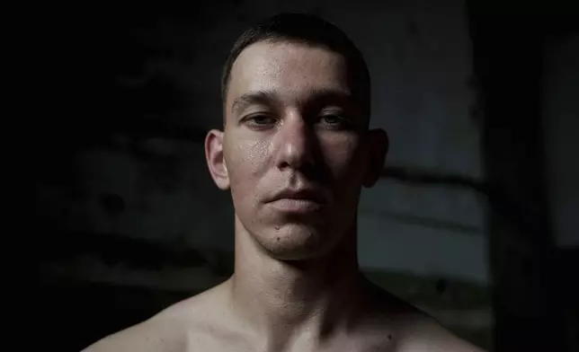 Maj. Oleksii Bordun, a Ukrainian soldier known as Satyrenko who survived the explosions at the Russian-controlled Olenivka prison two years ago, sits for a portrait in Lyman, Donetsk region, Ukraine, Thursday, July 11, 2024. “For me and for all of us, this day is a tragedy,” Bordun said. (AP Photo/Evgeniy Maloletka)