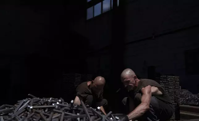 Prisoners assemble metal structures in a workshop in a prison, in the Dnipropetrovsk region, Ukraine, Friday, June 21, 2024. Ukraine is expanding its military recruiting to cope with battlefield shortages more than two years into fighting Russia’s full-scale invasion. (AP Photo/Evgeniy Maloletka)