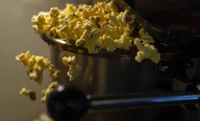 Popcorn pops for the 7 p.m. showing of Raising Arizona at the Littel Art Theatre on Thursday, May 16, 2024, in Yellow Springs, Ohio. (AP Photo/Carolyn Kaster)