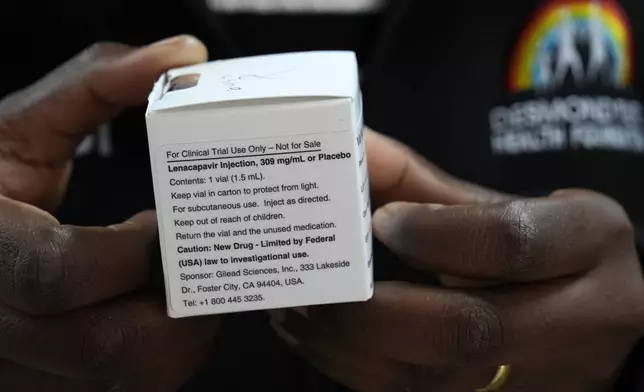 A pharmacist holds vials of lenacapavir, the new HIV prevention injectable drug, at the Desmond Tutu Health Foundation's Masiphumelele Research Site, in Cape Town, South Africa, Tuesday, July 23, 2024, which was one of the sites for Gilead's lenacapavir drug trial. (AP Photo/Nardus Engelbrecht)