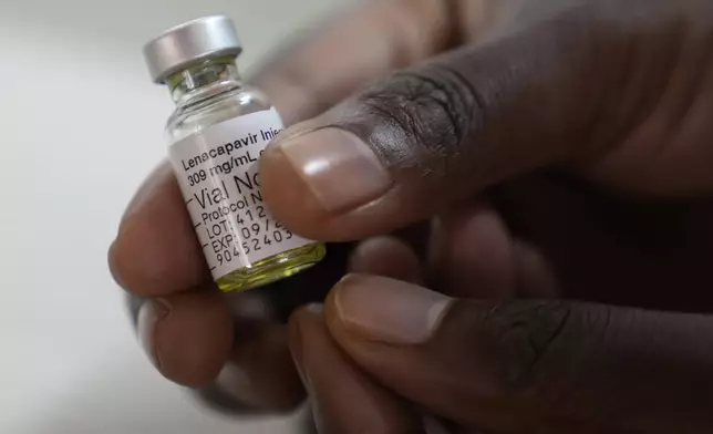 A pharmacist holds a vial of lenacapavir, at the Desmond Tutu Health Foundation's Masiphumelele Research Site, in Cape Town, South Africa, Tuesday, July 23, 2024. (AP Photo/Nardus Engelbrecht)