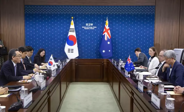 South Korean Foreign Minister Cho Tae-yul, left, talks with Australian Foreign Minister Penny Wong, right, during their meeting at the foreign ministry in Seoul, South Korea, Tuesday, July 30, 2024. (Jeon Heon-kyun/Pool Photo via AP)