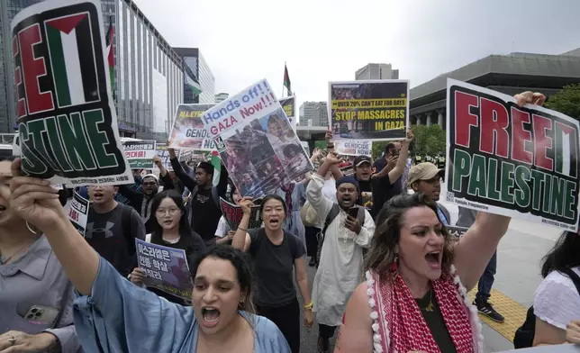 Demonstrators supporting Palestinians march during a rally calling to stop genocide in Gaza, in Seoul, South Korea, Saturday, July 6, 2024. (AP Photo/Ahn young-joon)