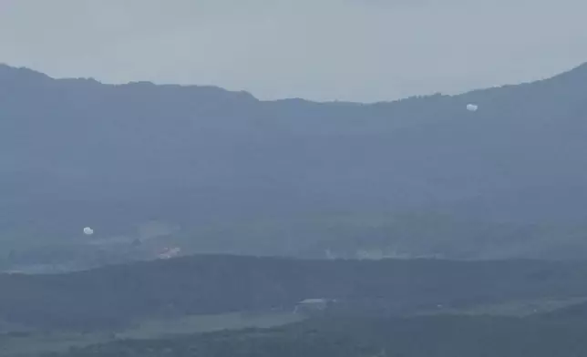 Balloons are seen from the Unification Observation Post in Paju, South Korea, near the border with North Korea, South Korea, Wednesday, July 24, 2024. (AP Photo/Ahn Young-joon)