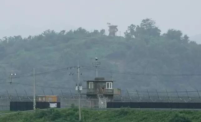 A North Korean military guard post, top, and a South Korean post, bottom, are seen from Paju, South Korea, near the border with North Korea, Friday, July 19, 2024. South Korea said Friday it has restarted blasting propaganda broadcasts into North Korea to retaliate against the North's latest round of trash-carrying balloon launches, a resumption of Cold War-style tactics that are raising animosities between the rivals. (AP Photo/Ahn Young-joon)