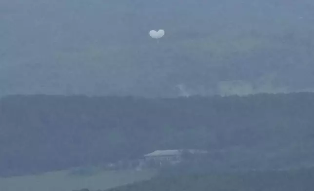 Balloons are seen from the Unification Observation Post in Paju, South Korea, near the border with North Korea, South Korea, Wednesday, July 24, 2024. (AP Photo/Ahn Young-joon)